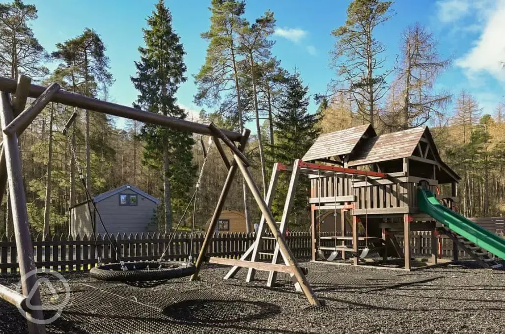 Children's playground with swings and slides Children's playground with swings and slides