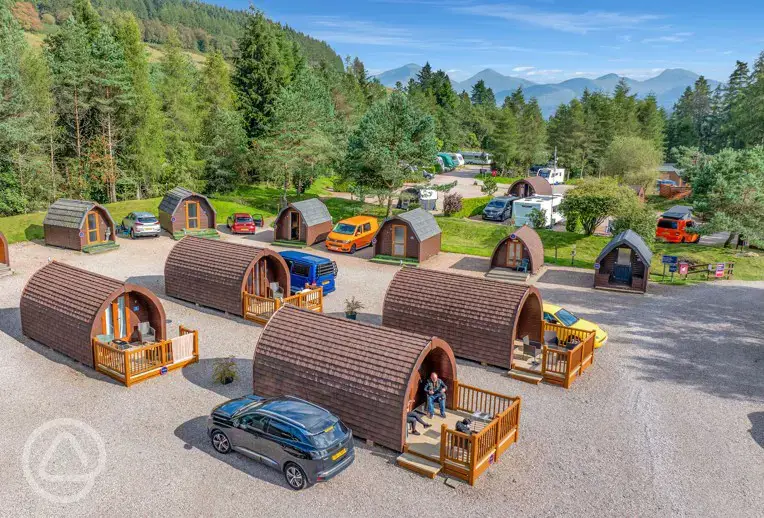 Aerial of the camping and glamping pods with mountain views