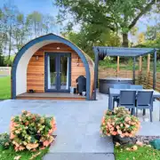 Luxury Cedar Pod at Shays Farm with a private hot tub and outdoor furniture