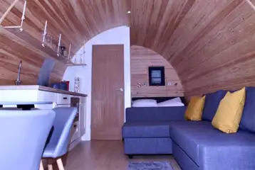 Double bed and settee (bedding included) in the Cedar Pods