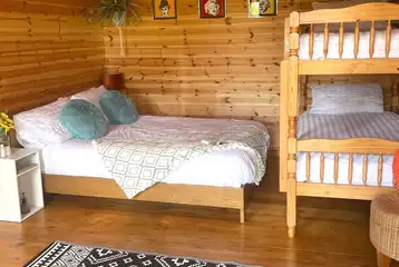 Large pod with a double bed and bunk beds Large pod with a double bed and bunk beds