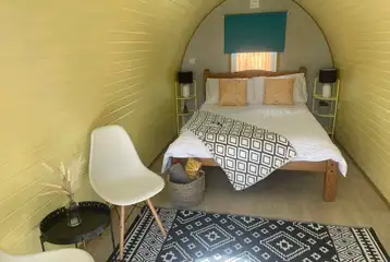 Camping pod with a double bed and bedding Camping pod with a double bed and bedding