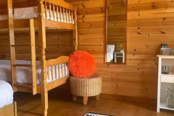 Large pod with a double bed and bunk beds Large pod with a double bed and bunk beds