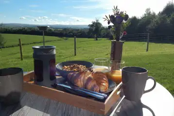 Outdoor dining area of the glamping lodges