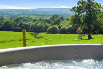 Glamping lodge hot tub with country views