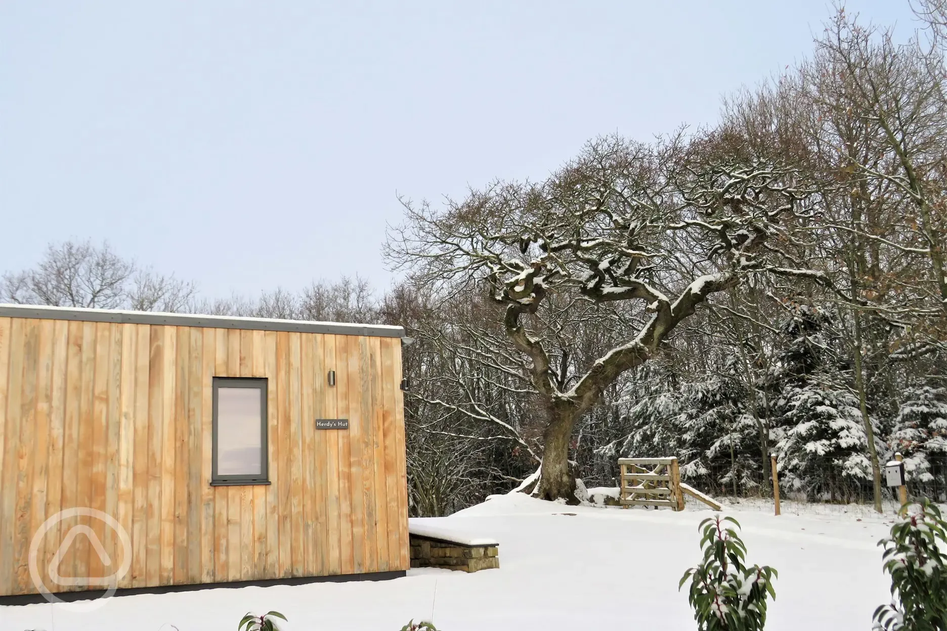 Glamping lodges in the snow at Thornbrook Barn