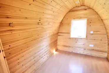 Camping pod interior, unfurnished and measuring 2.2m by 2.5m