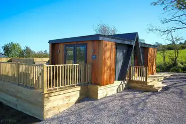 Merlin's Cabin with a private decking, hot tub and outdoor furniture