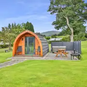 Ensuite glamping pod exterior with outdoor seating, fire pit and hot tub Ensuite glamping pod exterior with outdoor seating, fire pit and hot tub