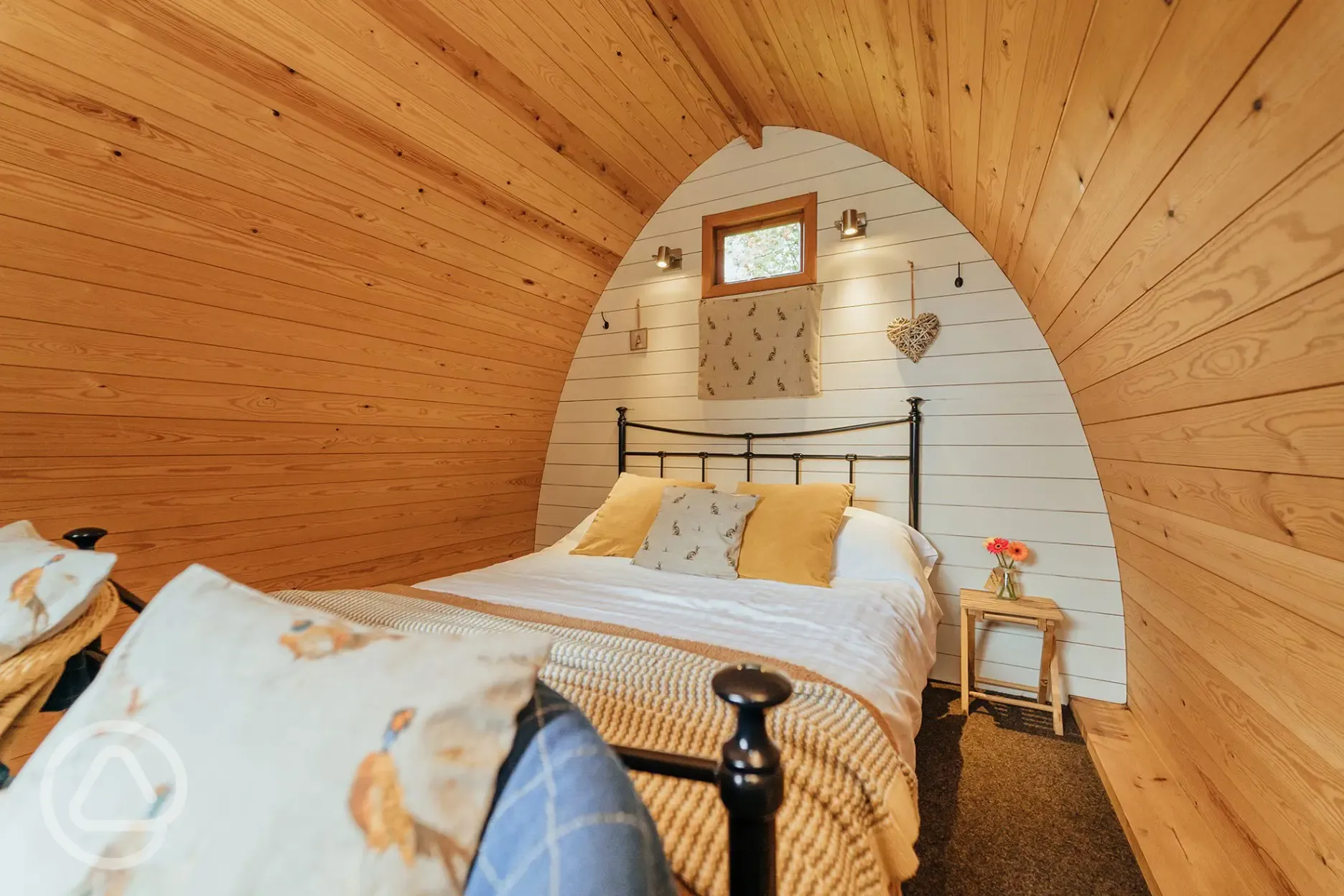 Cosy wooden camping pod interior