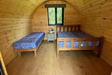 Family pods featuring double bed and single bed Family pods featuring double bed and single bed