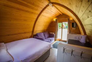 Camping mega pod furnishings with a Freeview TV