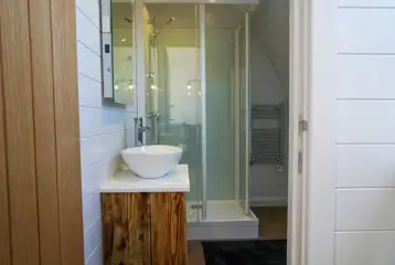 Side entry pod ensuite with a shower and toilet
