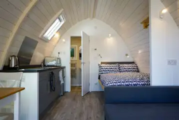 Elite pod well-equipped kitchenette and dining space