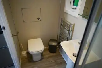 Elite pod ensuite bathroom with a toilet and shower