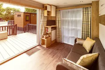 Ensuite glamping pod interior with a TV