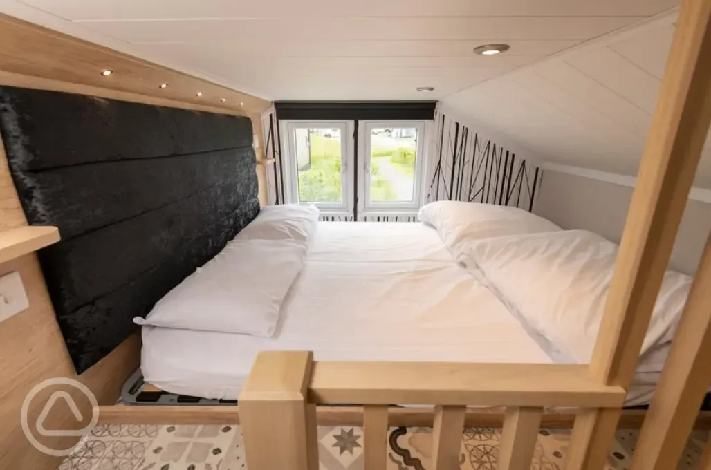 Ensuite glamping cabin mezzanine bedroom