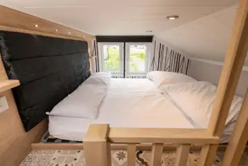 Ensuite glamping cabin mezzanine twin bedroom (accessed by a step ladder)