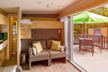 Ensuite glamping pod sofa bed, bunk bed and small kitchenette