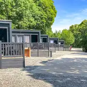 Ensuite glamping pods with raised decking areas and outdoor seating Ensuite glamping pods with raised decking areas and outdoor seating