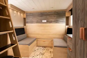 Glamping cabin dining area with a pull-down double bed