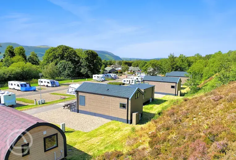 Glamping pods and cabins with views to the touring pitches
