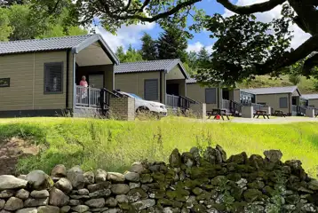 Ensuite glamping cabins with covered outdoor deck areas