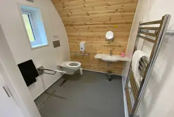 Accessible glamping pod wet room with grab rails