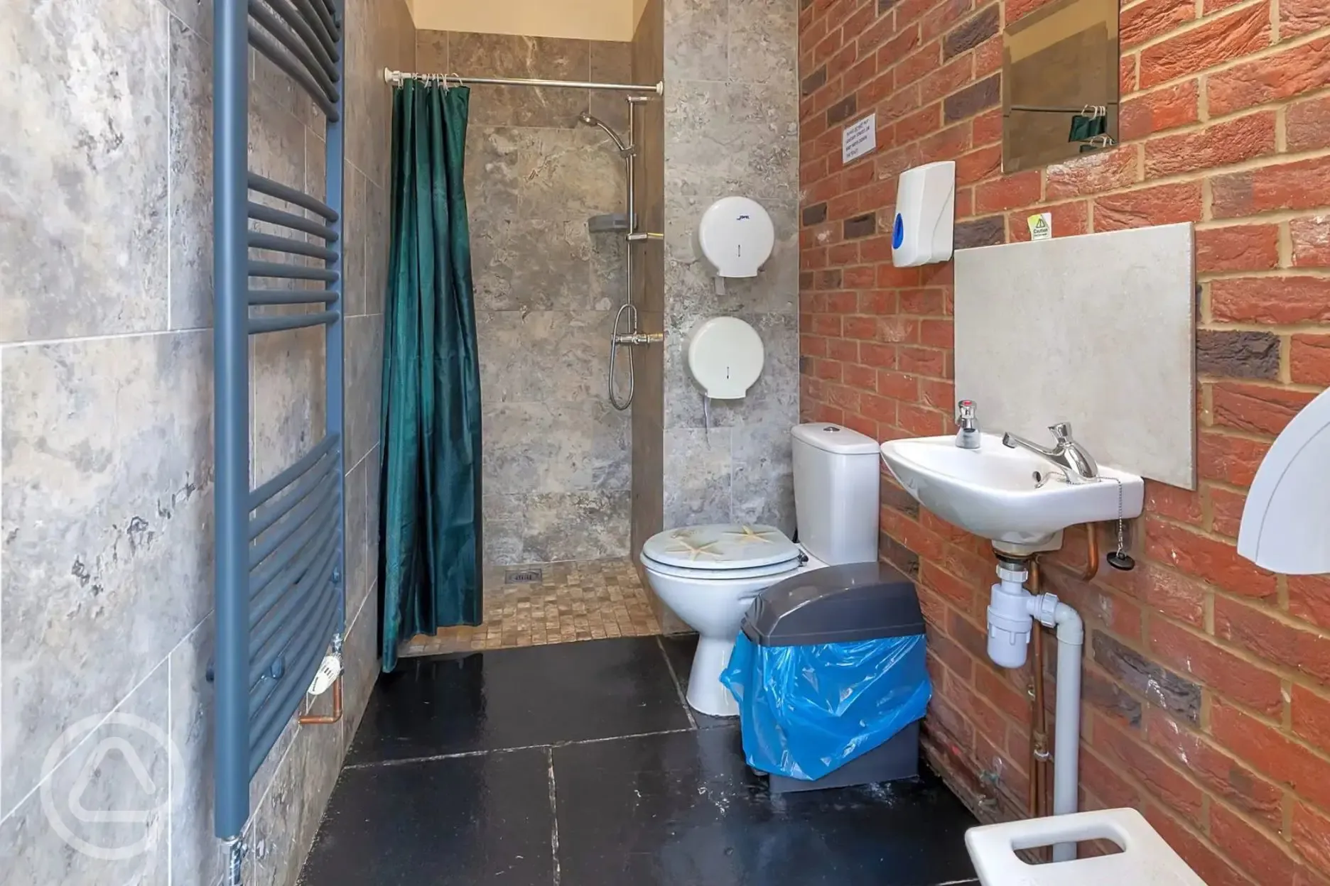 Toilets and showers interior with sink and heated towel rail