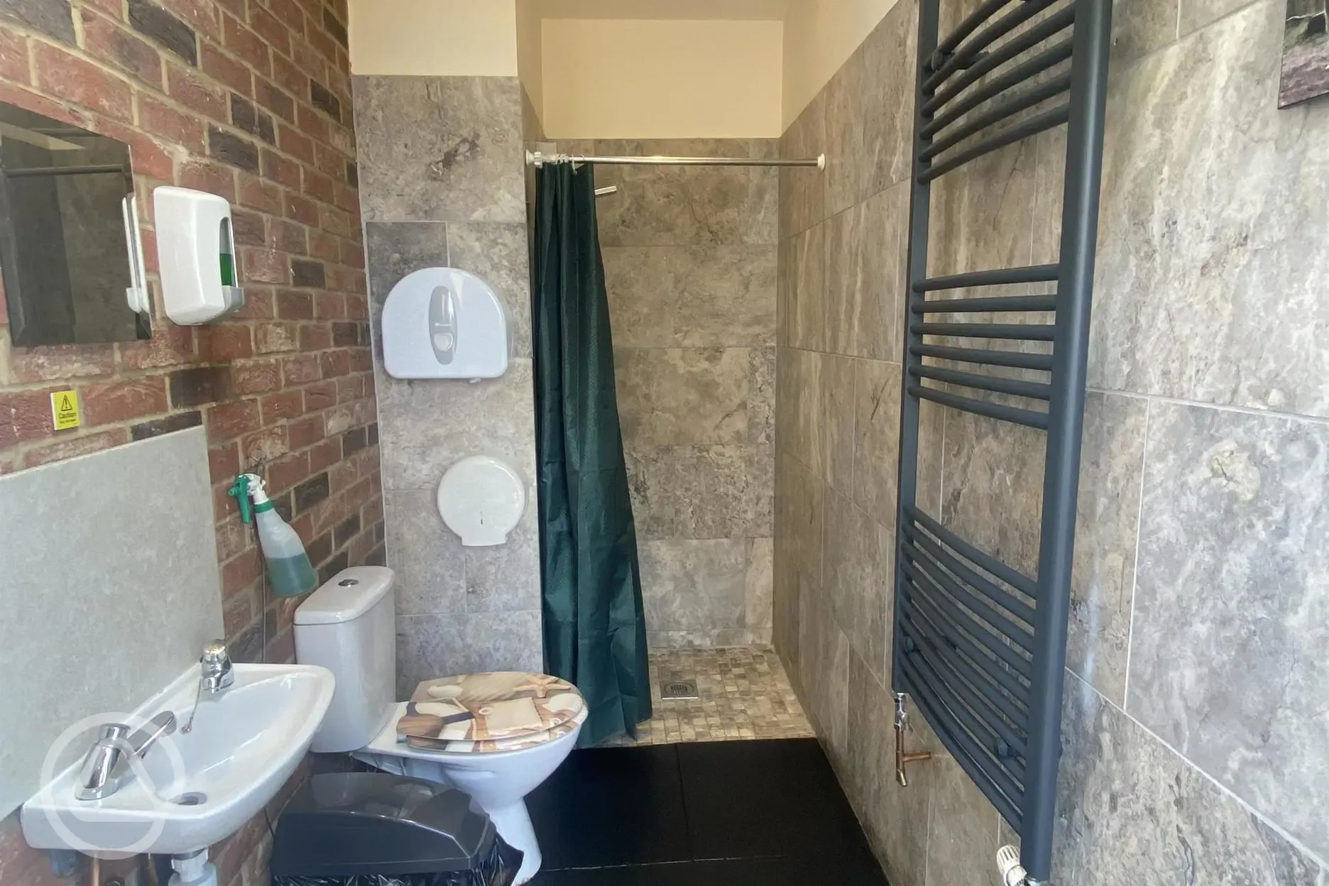 Toilets and showers interior with sink, mirror and heated towel rail