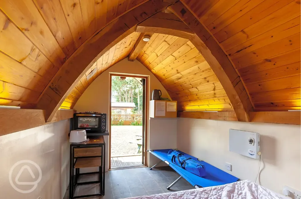 Oak Pods interior with camp bed, oven and grill