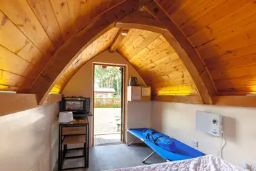 Oak Pods interior with camp bed, oven and grill