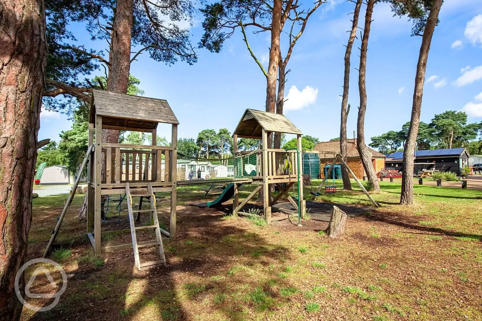 Children's play park with climbing frame and swings
