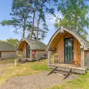 Oak pods exterior with outside decking area with seating Oak pods exterior with outside decking area with seating