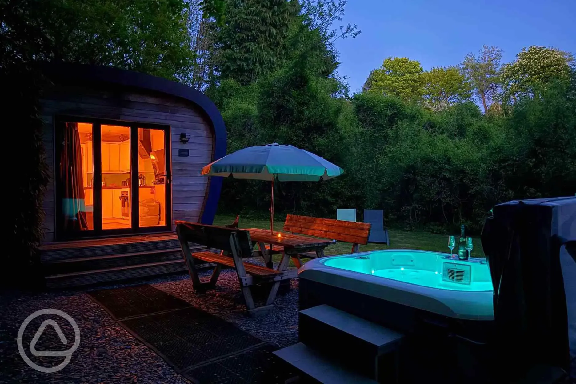 Sunridge Eco Pod with hot tub at night