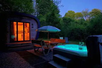 Sunridge Eco Pod with hot tub at night Sunridge Eco Pod with hot tub at night