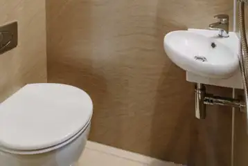 Ensuite glamping pod bathroom with a toilet and shower