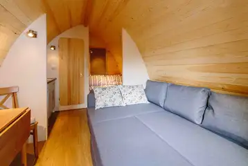 Ensuite glamping pod L-shape sofa folded out to a double sofa bed