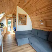 Alpaca pod with an L-shaped sofa, a double bed and kitchen (bring bedding)