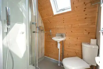 Owl pod ensuite with a toilet, hand basin and shower (bring towels)