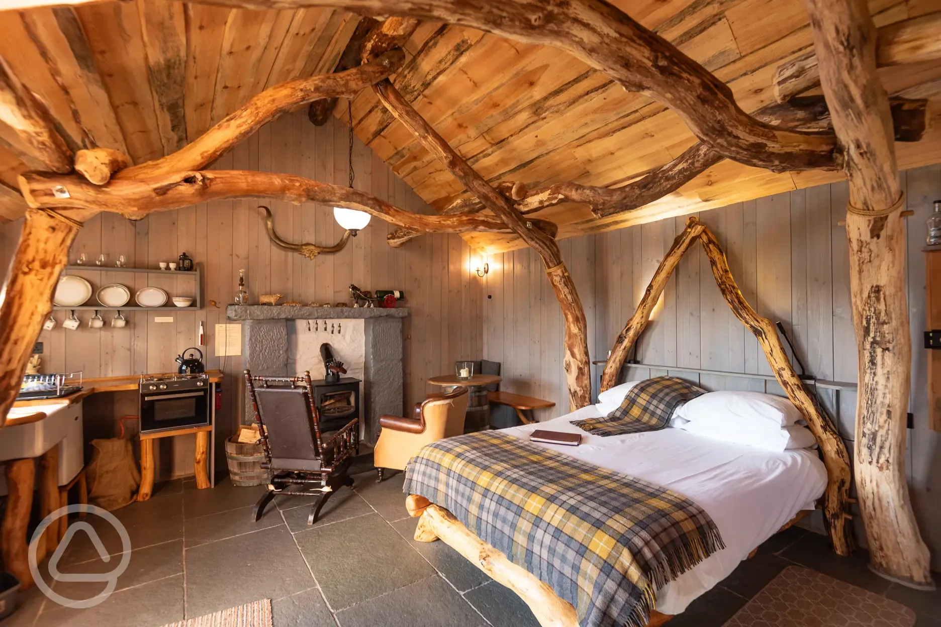 Whisky Howf Cabin interior with a wood burning stove Whisky Howf Cabin interior with a wood burning stove