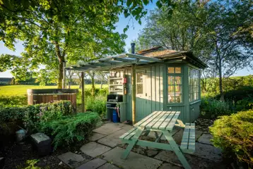 Summer Howf glamping cabin with a picnic table Summer Howf glamping cabin with a picnic table