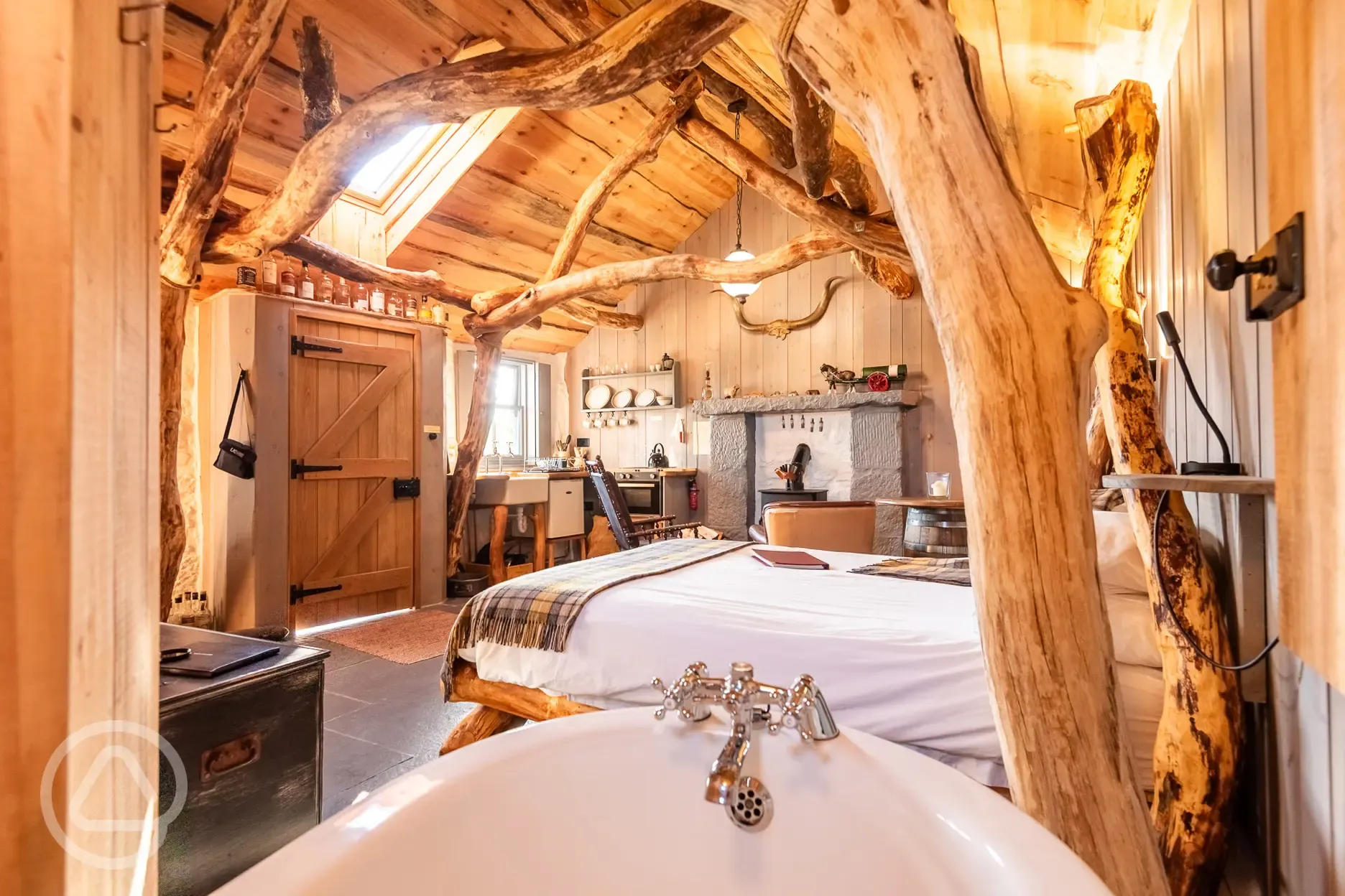 Whisky Howf Cabin interior with a king size bed and slipper bath Whisky Howf Cabin interior with a king size bed and slipper bath