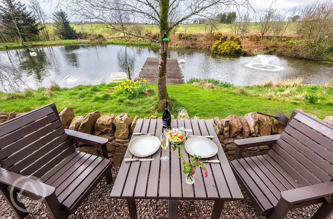 Whisky Howf Cabin outdoor seating area with lake views Whisky Howf Cabin outdoor seating area with lake views