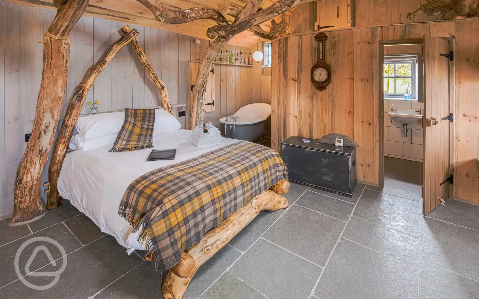 Whisky Howf Cabin interior with a king size bed and slipper bath Whisky Howf Cabin interior with a king size bed and slipper bath