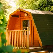 Cocoon camping pod with a small decking area