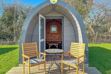 Camping pod (four person) with small decking and outdoor seating Camping pod (four person) with small decking and outdoor seating