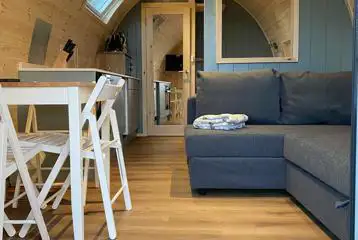 Mega ensuite glamping pod dining and living area Mega ensuite glamping pod dining and living area