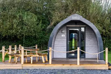 Mega glamping pod with a parking space and decking area