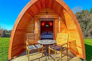 Camping pod (two person) with small decking and outdoor seating Camping pod (two person) with small decking and outdoor seating